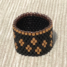 Load image into Gallery viewer, Via Nona Malibu woven ring in matte black with rose gold accents and border