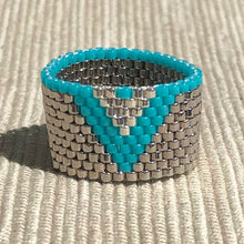 Load image into Gallery viewer, Via Nona Malibu woven ring in shiny silver with a blue vee design